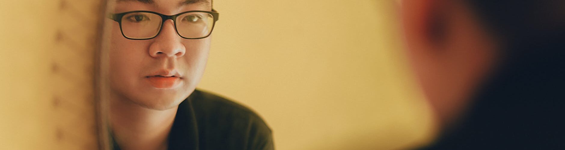 photo of man looking at the mirror