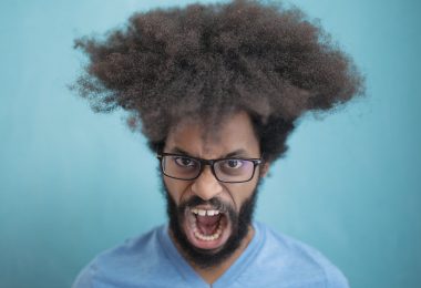 man in blue crew neck shirt wearing black framed eyeglasses