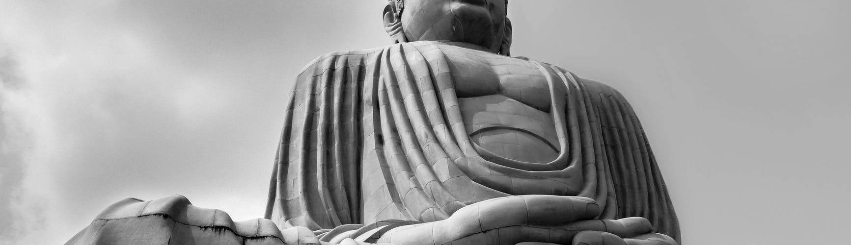 grayscale photo of buddha statue