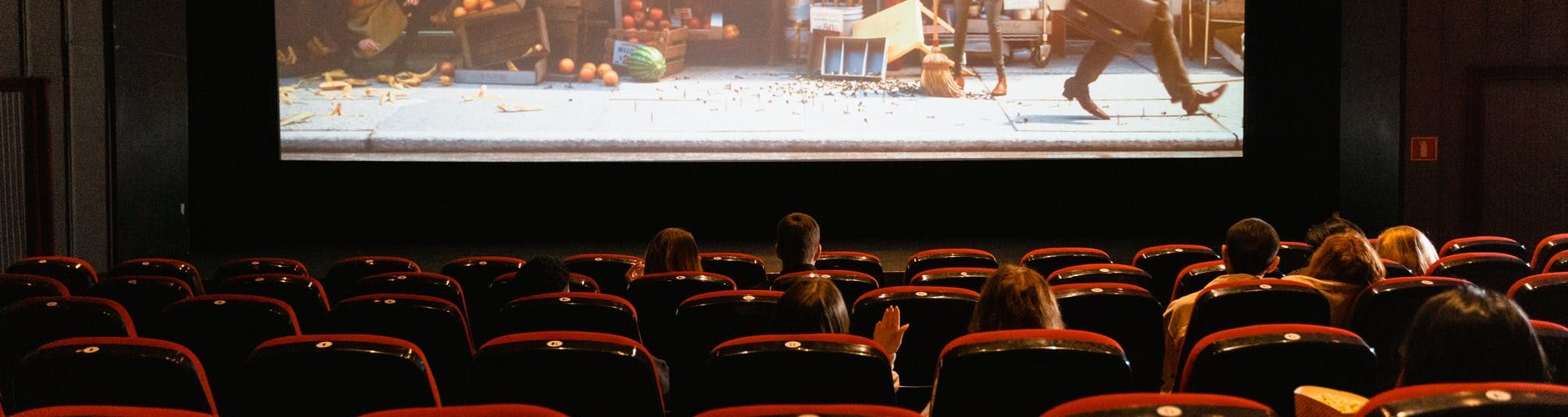 cartoon movie showing on theater screen
