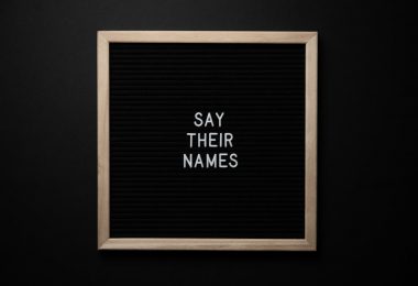 framed black picture with slogan say their names