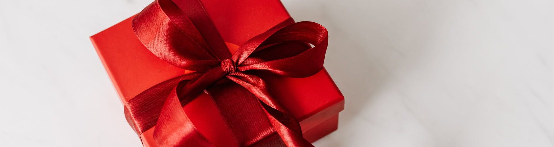 red gift box tied with ribbon