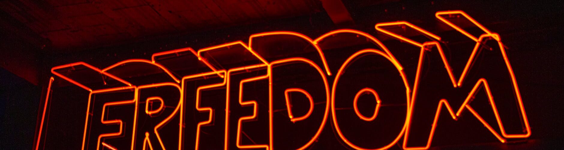 close up photo of red neon light signage
