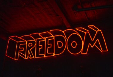 close up photo of red neon light signage