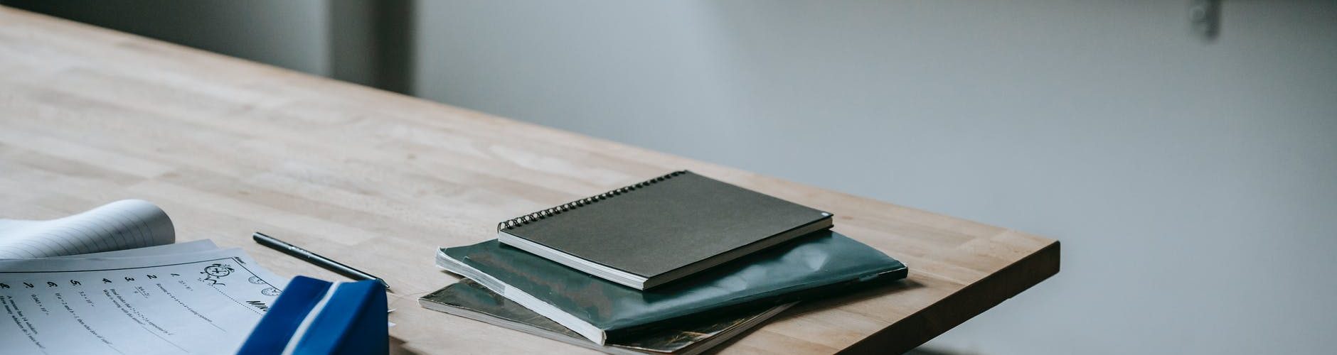 student desk with copybooks and pencil case