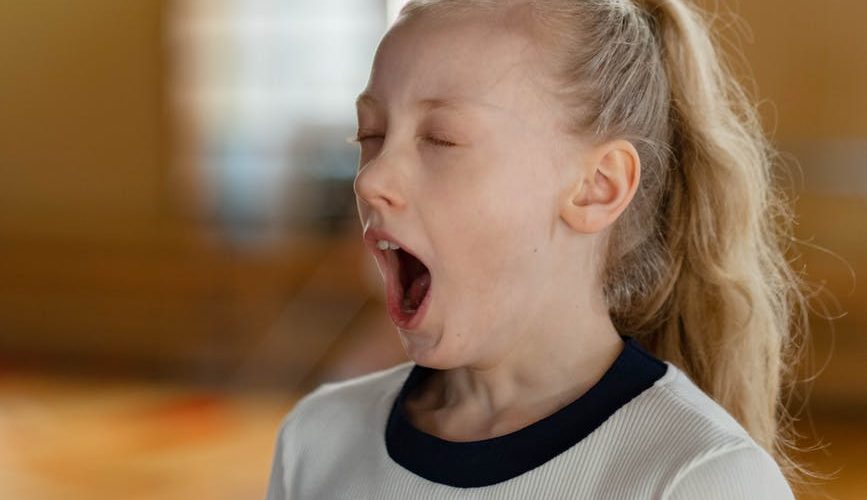 a girl yawning
