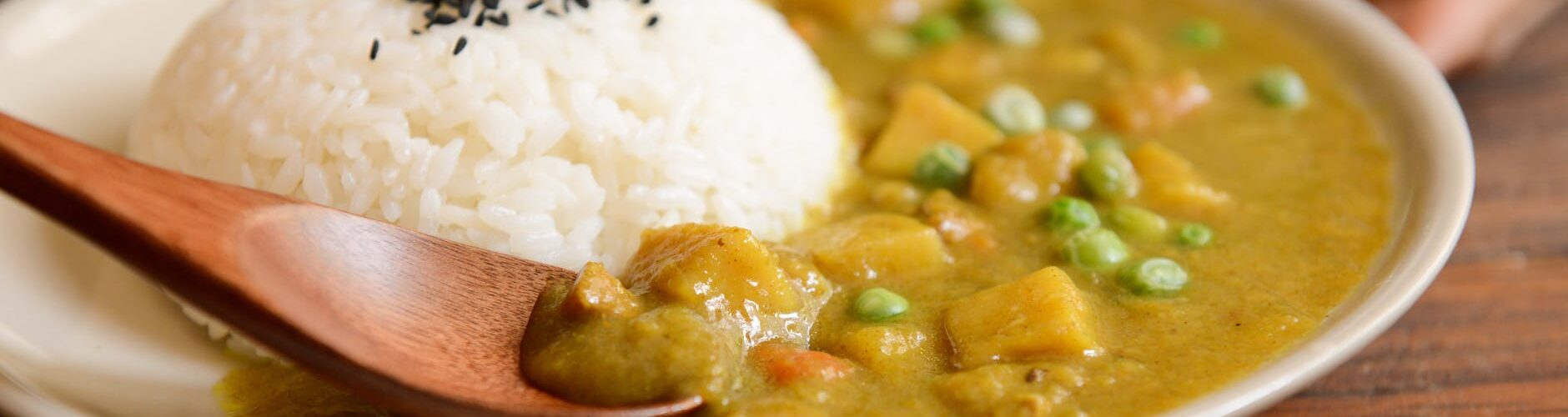 cooked rice and curry food served on white plate