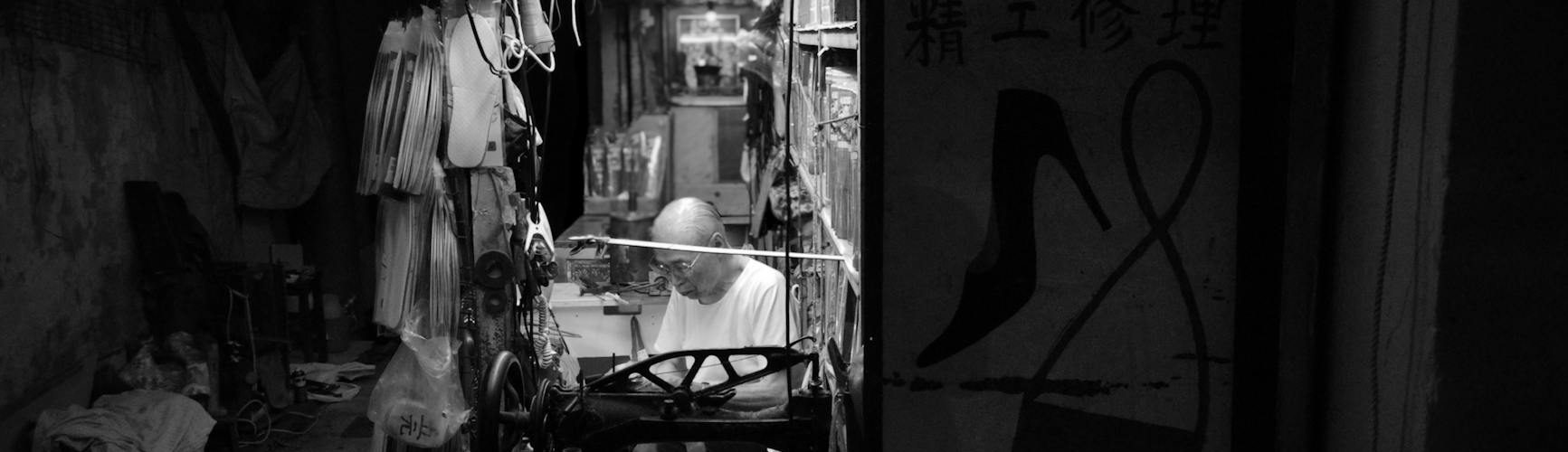 vintage hong kong cobbler shop at night