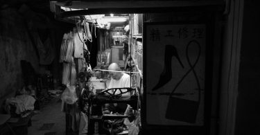 vintage hong kong cobbler shop at night