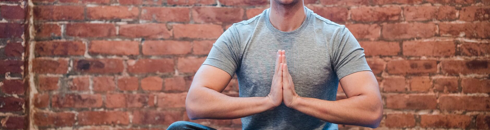 young man meditating in easy sit position
