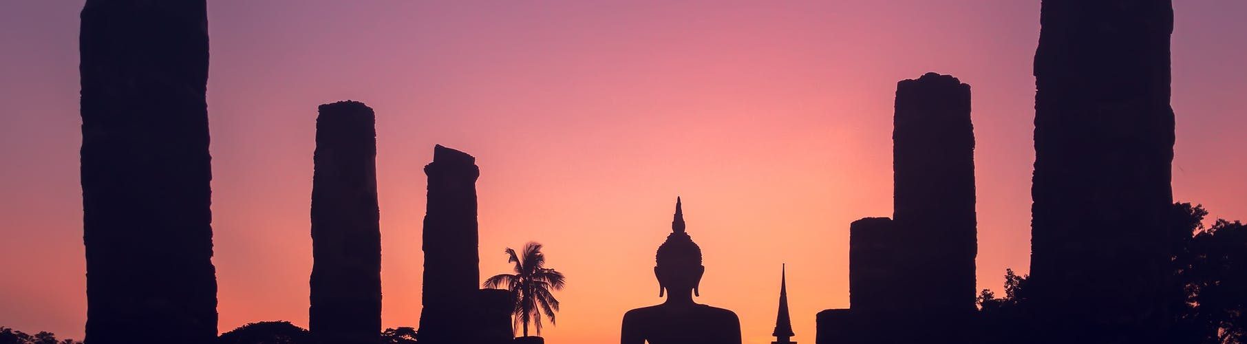 majestic sunset sky over big buddha statue