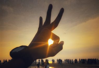 silhouette photography of people near body of water