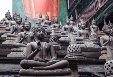 statues of buddha on stone stairs in oriental park
