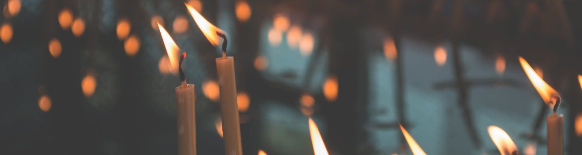 white candlestick with flame