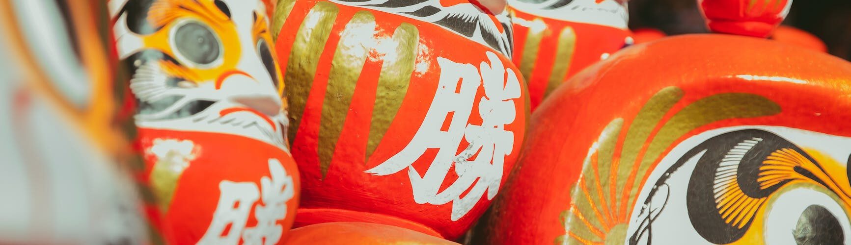 colorful daruma dolls on street
