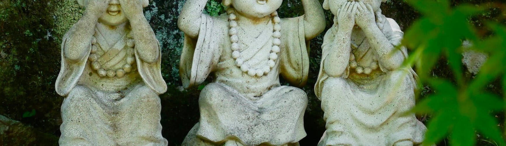 wise buddha statues in the garden