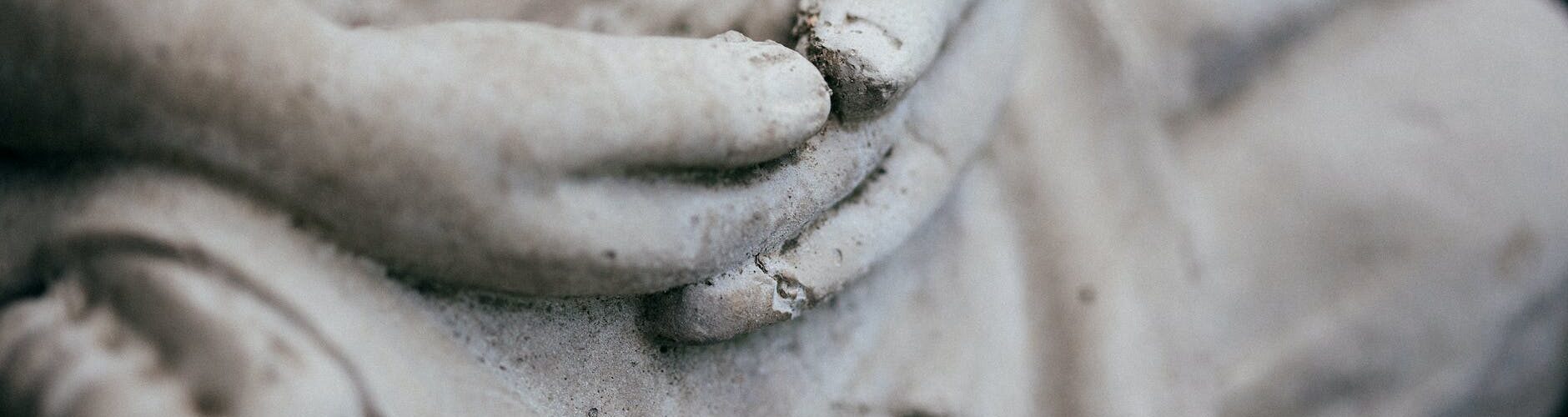 gray statue in close up photography