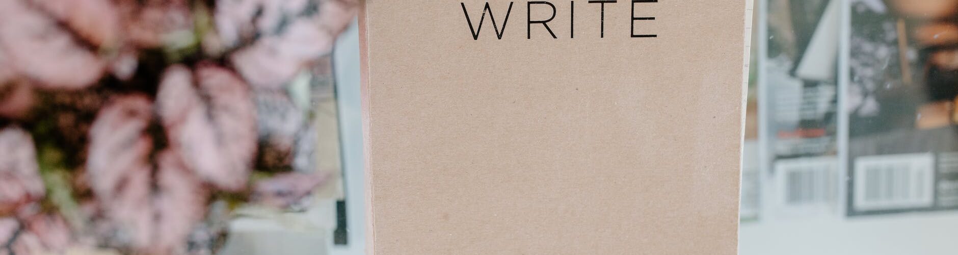 brown book on glass table