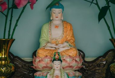 two buddha figurines