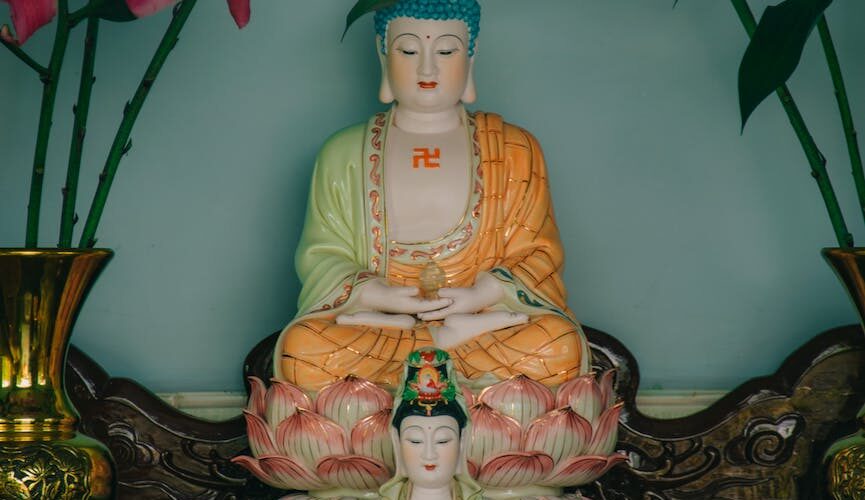 two buddha figurines
