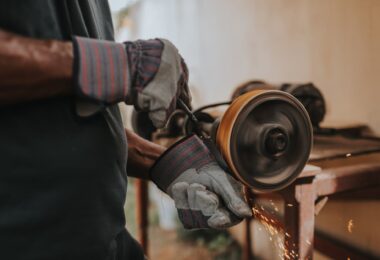 person holding black power tool