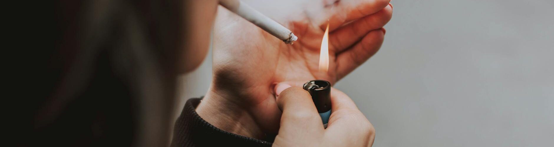 person smoking cigarette