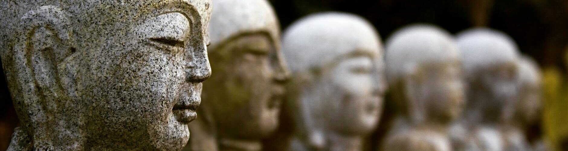 concrete statue in close up photography