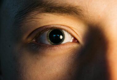 person s eye in close up photography