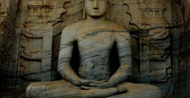 photograph of a meditating buddha statue