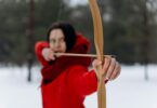 woman using wooden bow