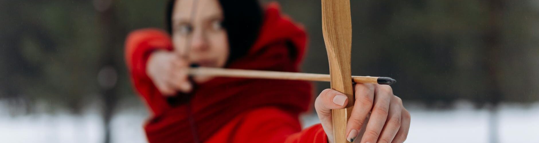 woman using wooden bow