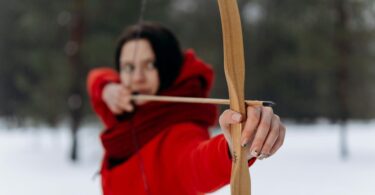woman using wooden bow