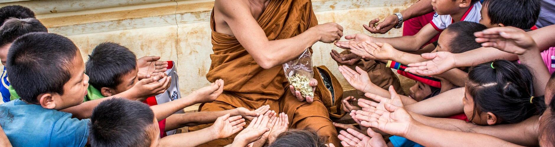 ma giving food to ground of people